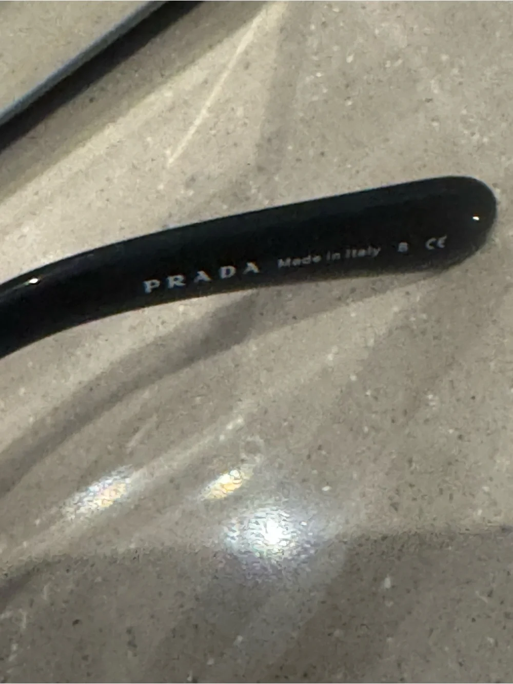 Prada Black Round Sunglasses with Swirl Arms